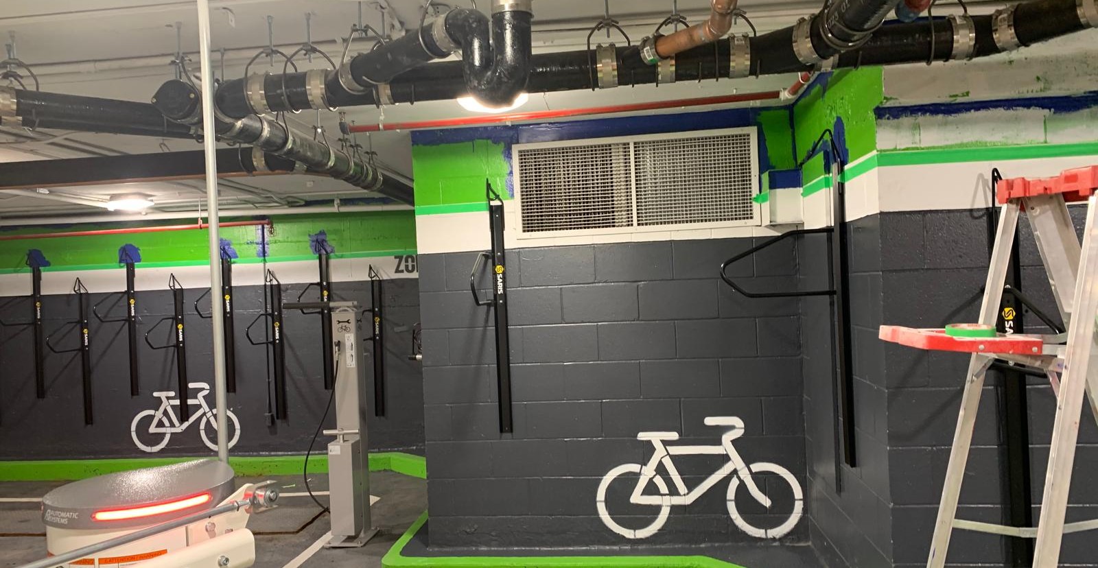 Freshly painted bicycle parking area in a Montréal commercial garage