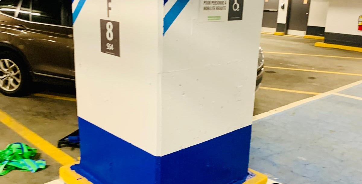 White parking column with a finished blue base